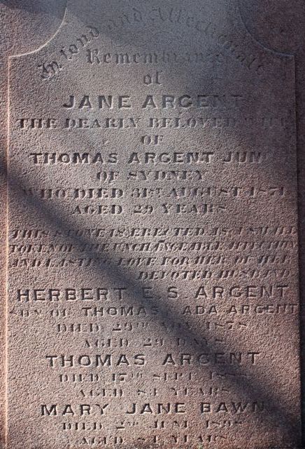 A weathered sandstone headstone inscribed with the names Jane Argent, Herbert E. S. Argent, Thomas Argent, and Mary Jane Bawn, who died 2nd June 1898 aged 84 years.
